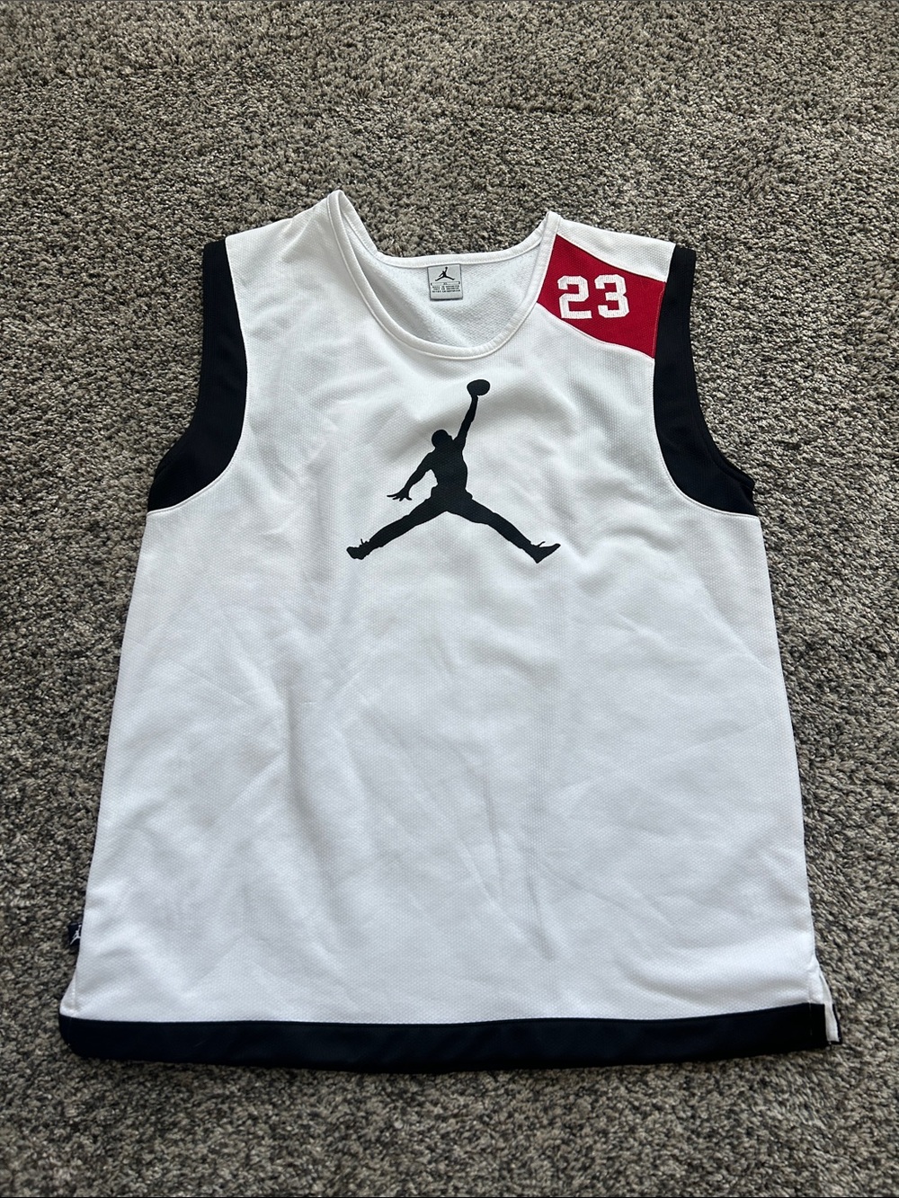 Nike White and Black Jordan Sleeveless Basketball Top with Red Accent